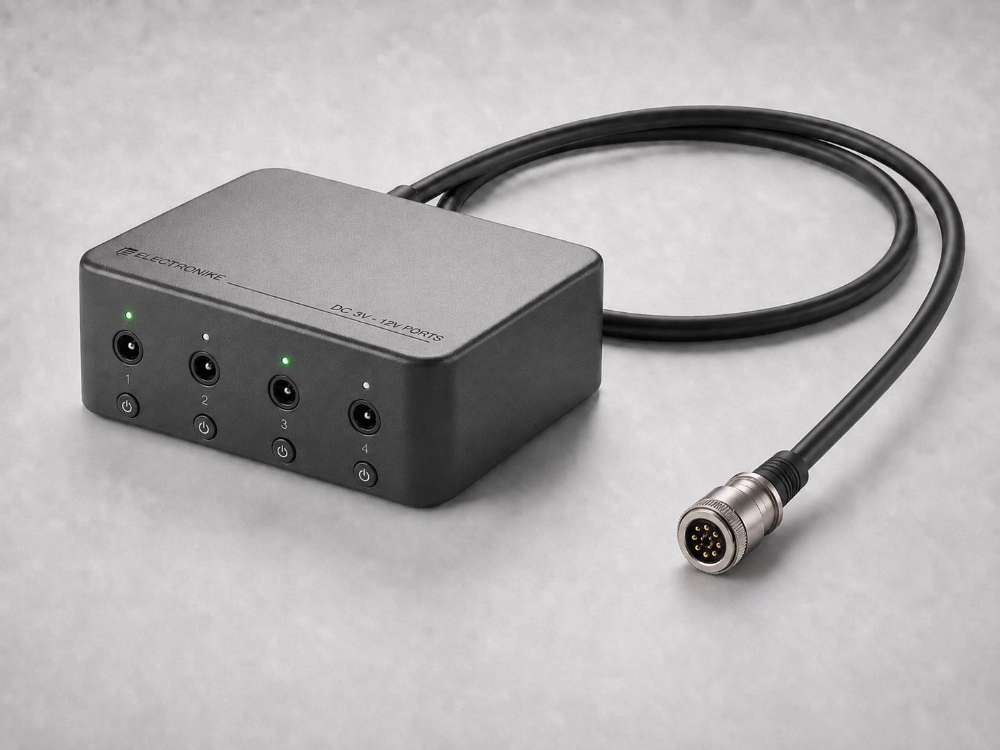 Variable-voltage DC expansion module with four barrel-jack outputs and a magnetic connector cable